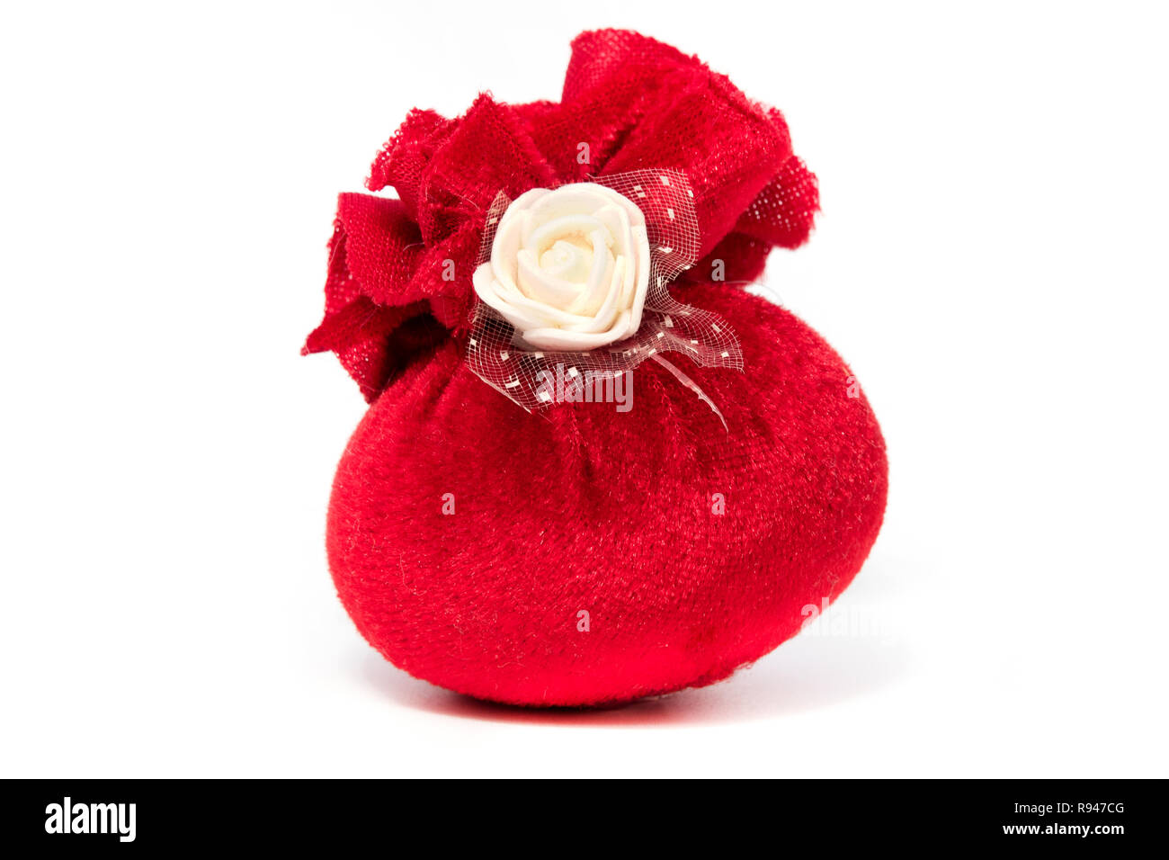 Red festive pouch with white rose on a white background Stock Photo