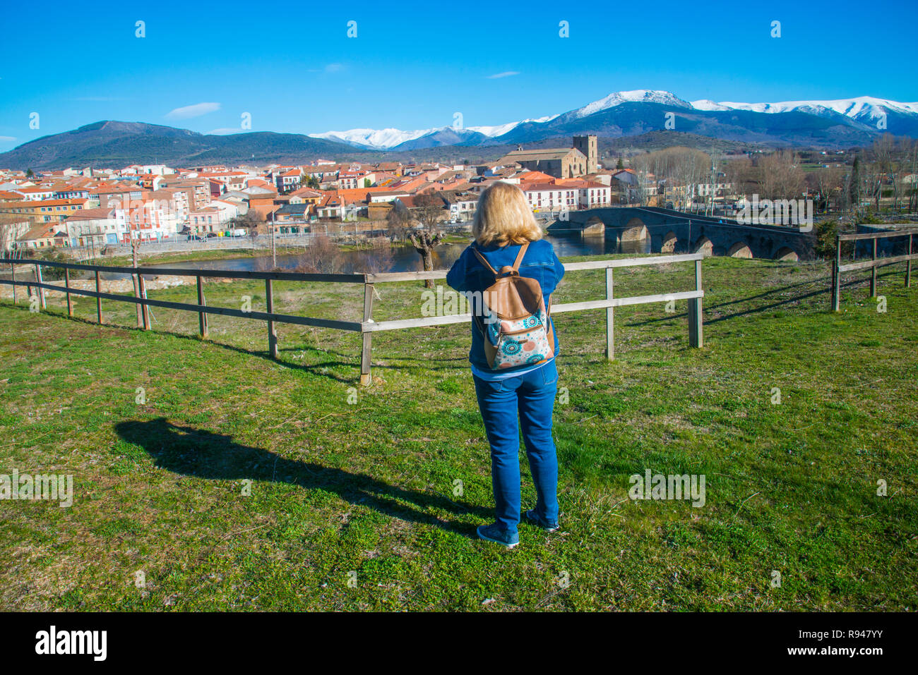 Woman taking photos of the village. El Barco de Avila, Avila province, Castilla Leon, Spain. Stock Photo