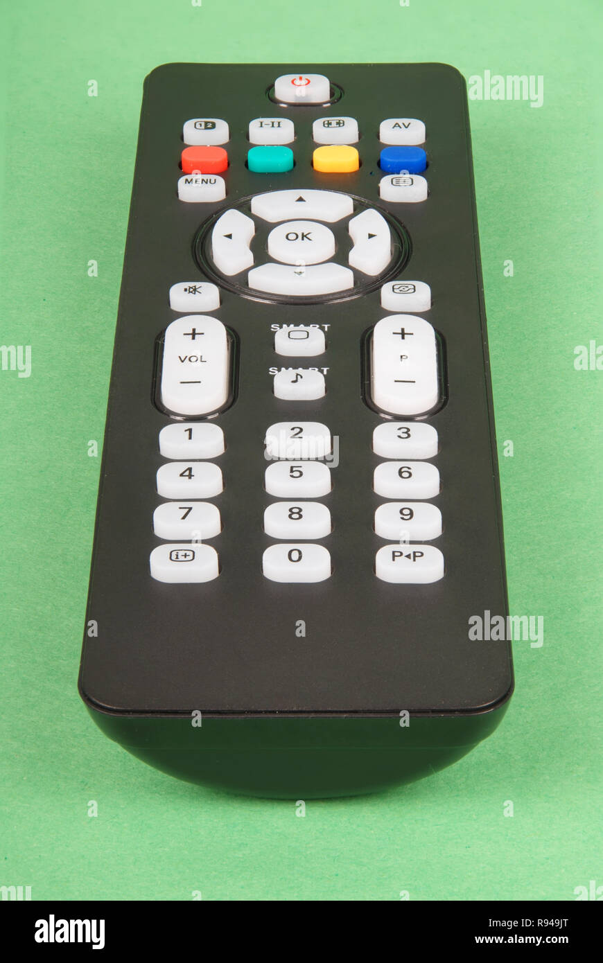 Black remote control for TV isolated on green background Stock Photo ...