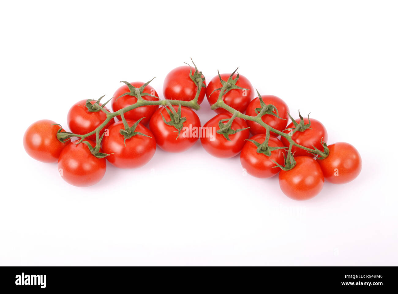 Cherry tomatoes on branch isolated on white background Stock Photo - Alamy