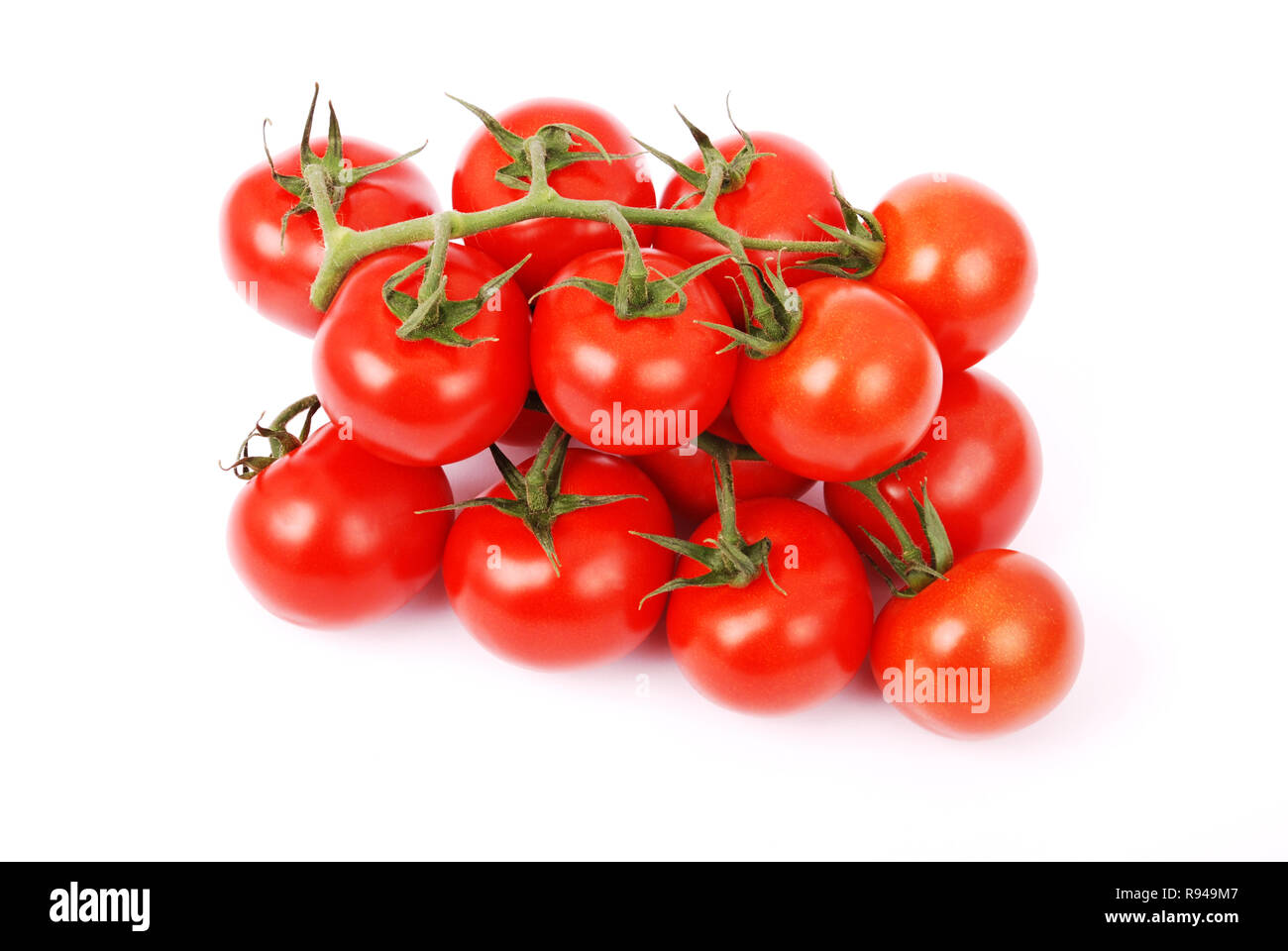 Cherry tomatoes on branch isolated on white background Stock Photo - Alamy