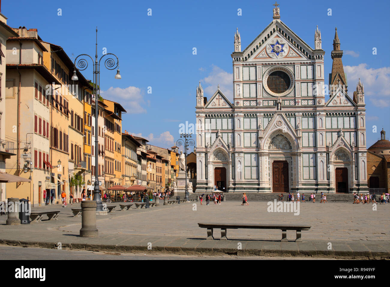 Florence, Italy - August 9, 2018: People on the square in front of Basilica di Santa Croce. It is the burial place of some of the most illustrious Ita Stock Photo