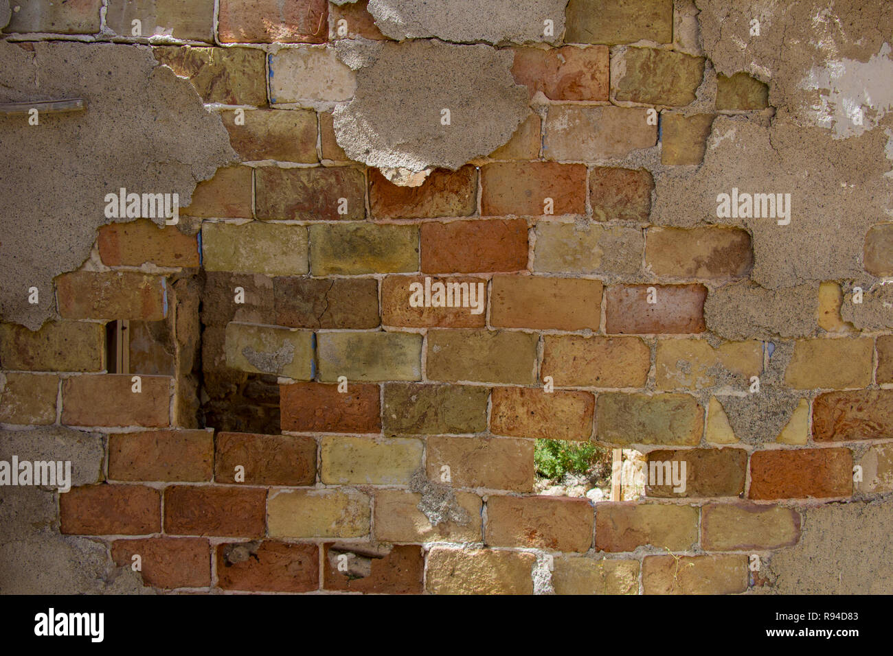 old brick wall, mud brick wall, worn brick Stock Photo