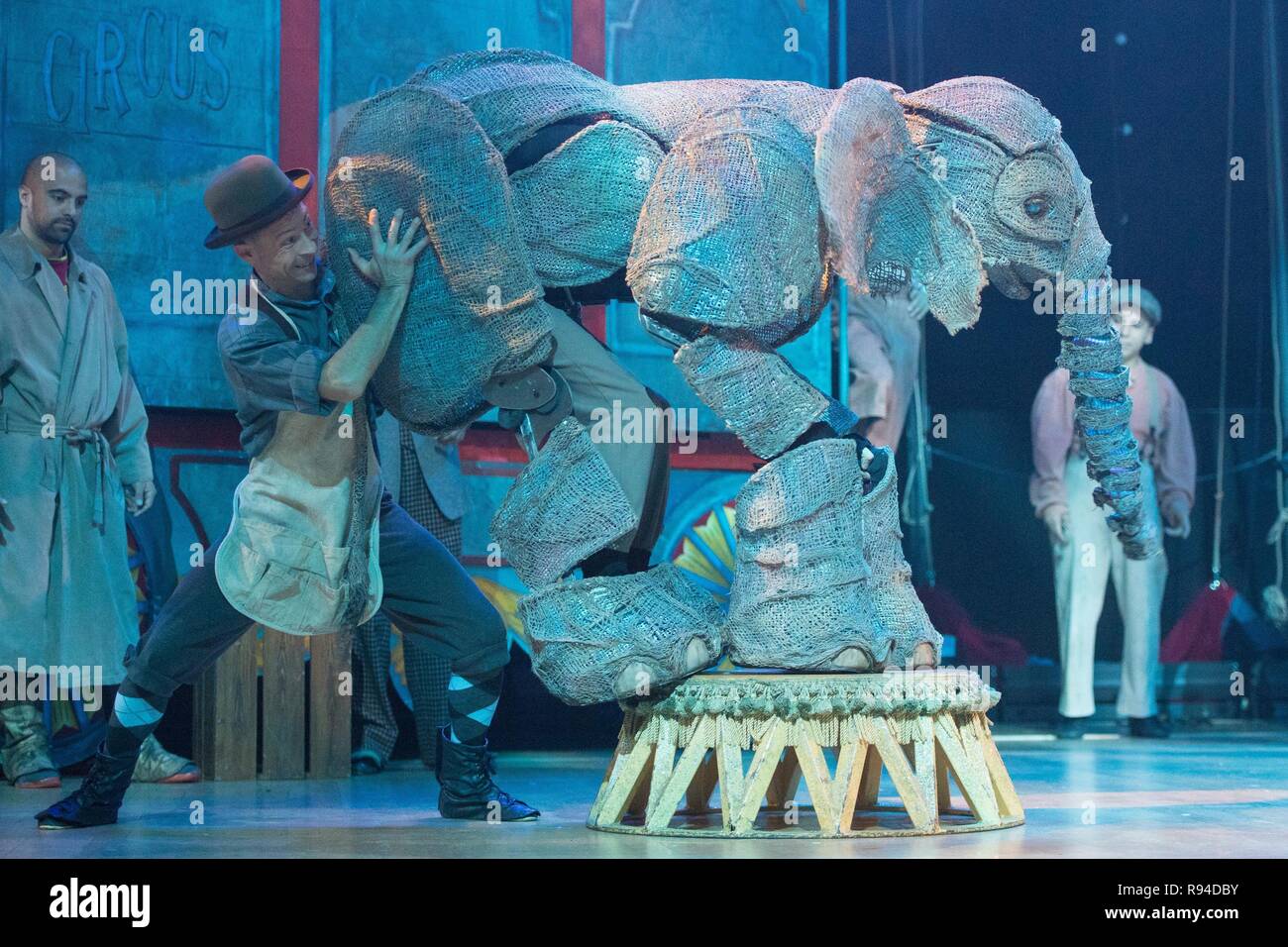 Performers alongside a baby elephant puppet during a photocall ahead of the opening night of Circus 1903, which features life-sized elephants created by puppeteers from War Horse, acrobats, contortionists, jugglers, trapeze and high wire performers, at the Royal Festival Hall, London. Stock Photo