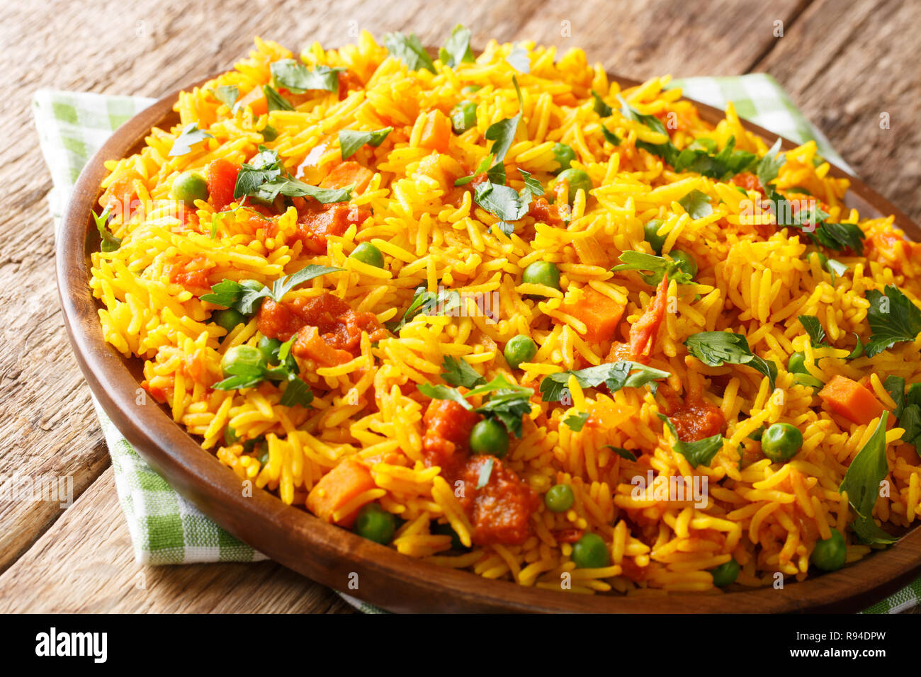 Traditional Indian street food rice with vegetables close-up on a plate on the table. horizontal Stock Photo
