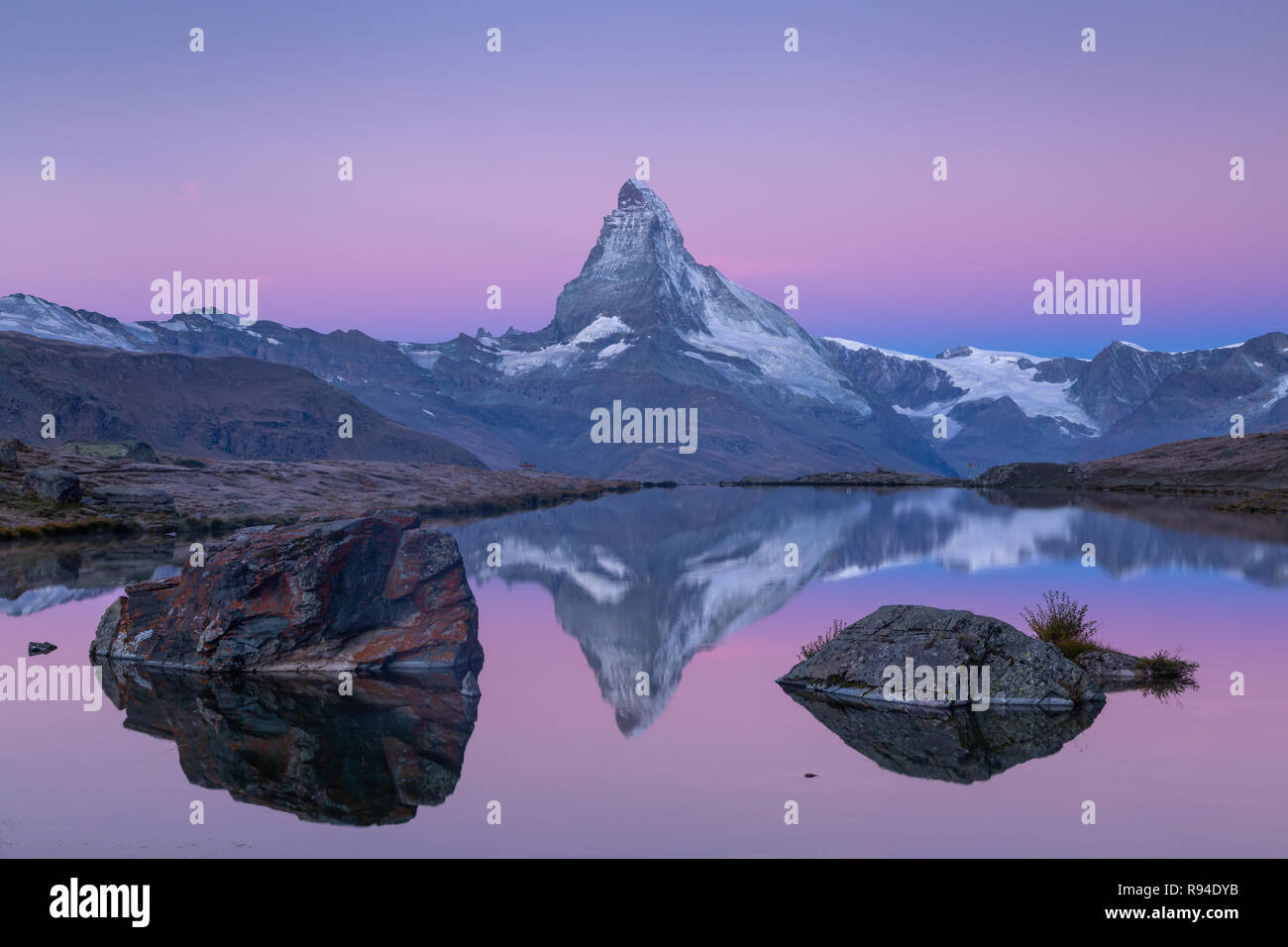 The famous Matterhorn reflected in the Stellisee during dawn. Zermatt ...