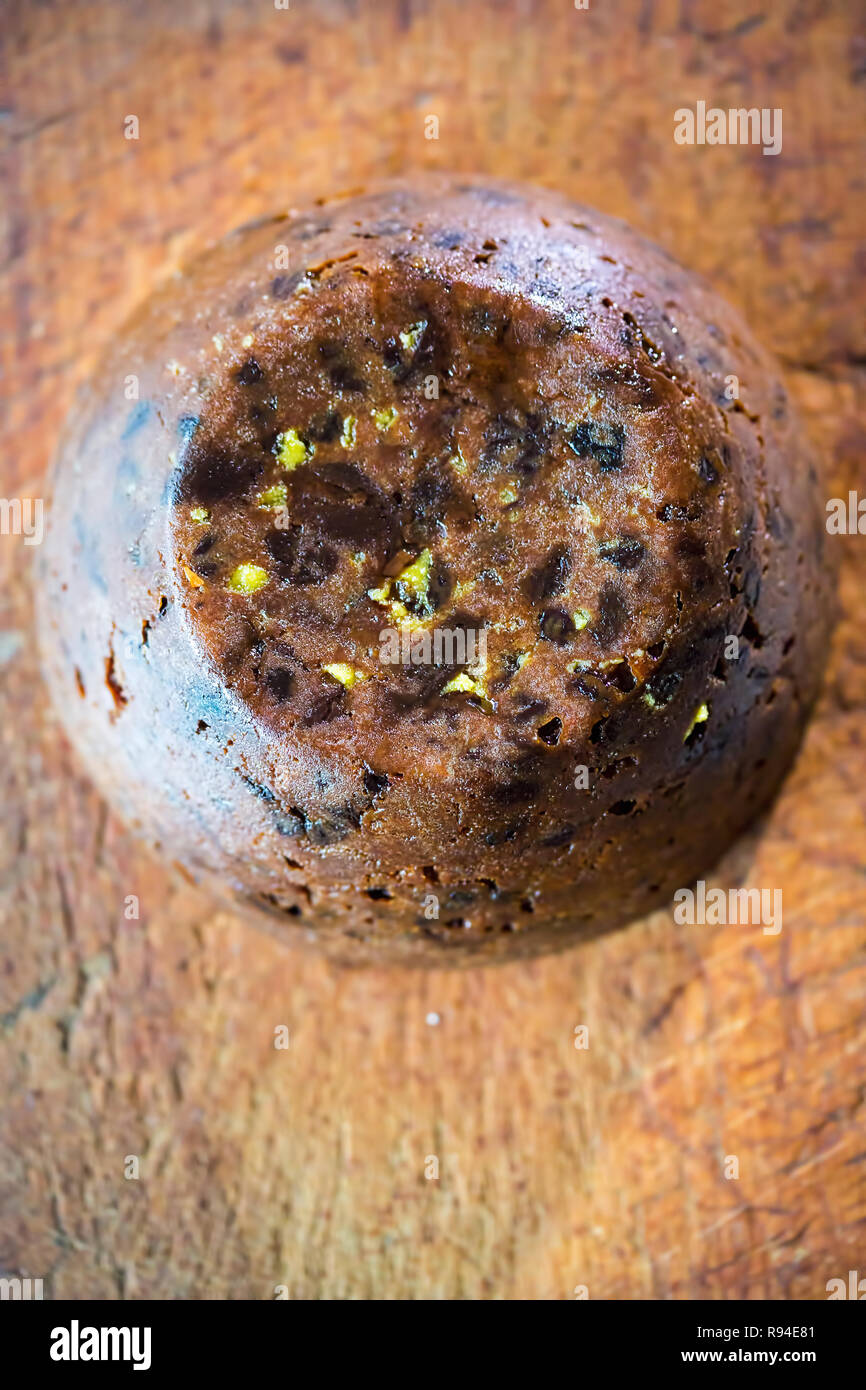 Christmas pudding on wooden board Stock Photo