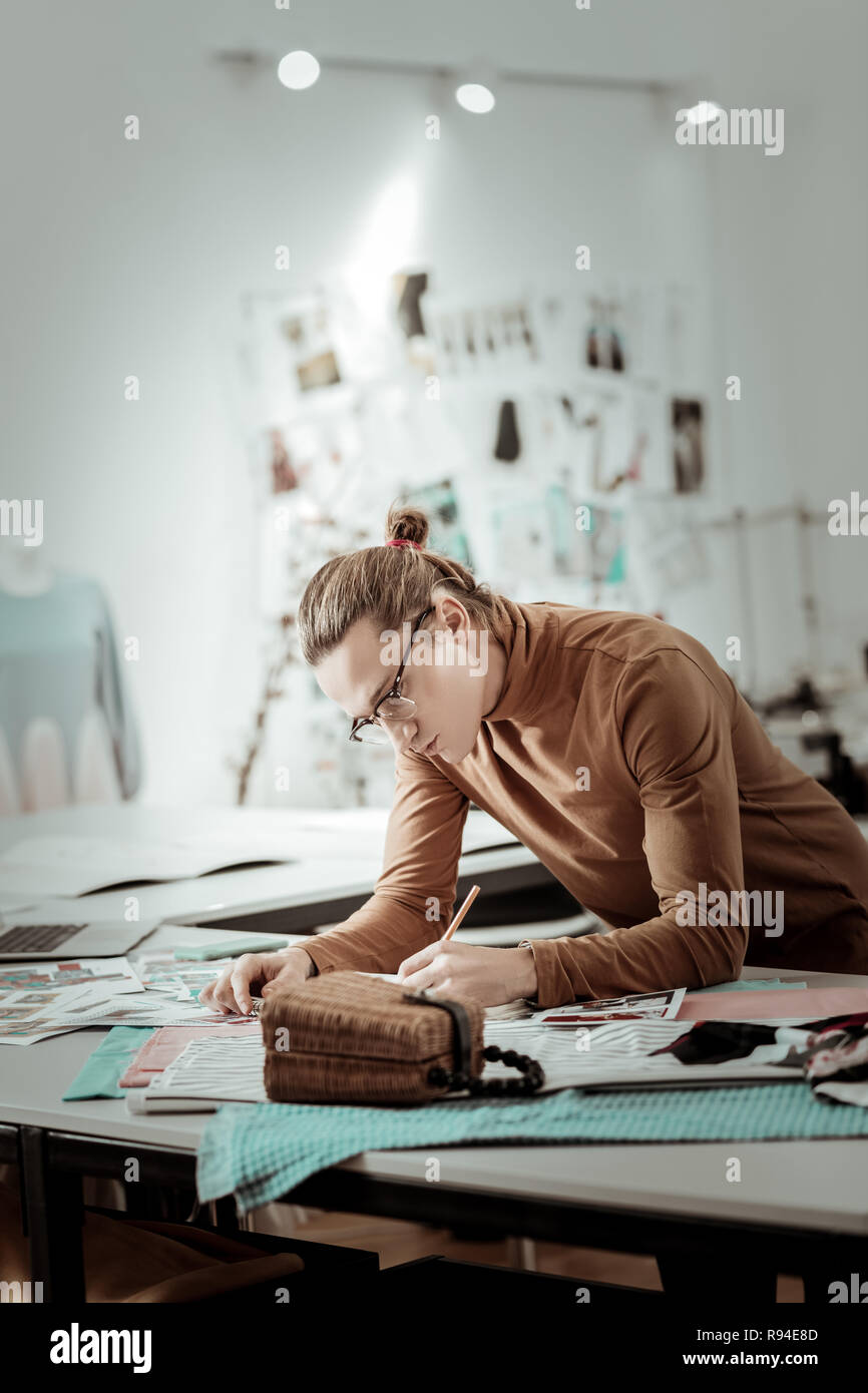 Young Fair Haired Designer From Fashion School Drawing New Models