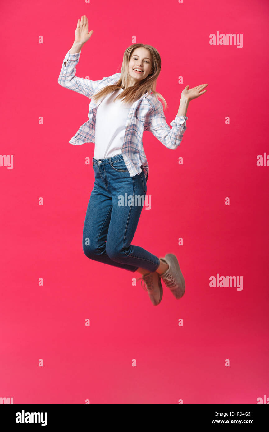 Full length portrait of a crazy joyful girl in casual cloth while ...