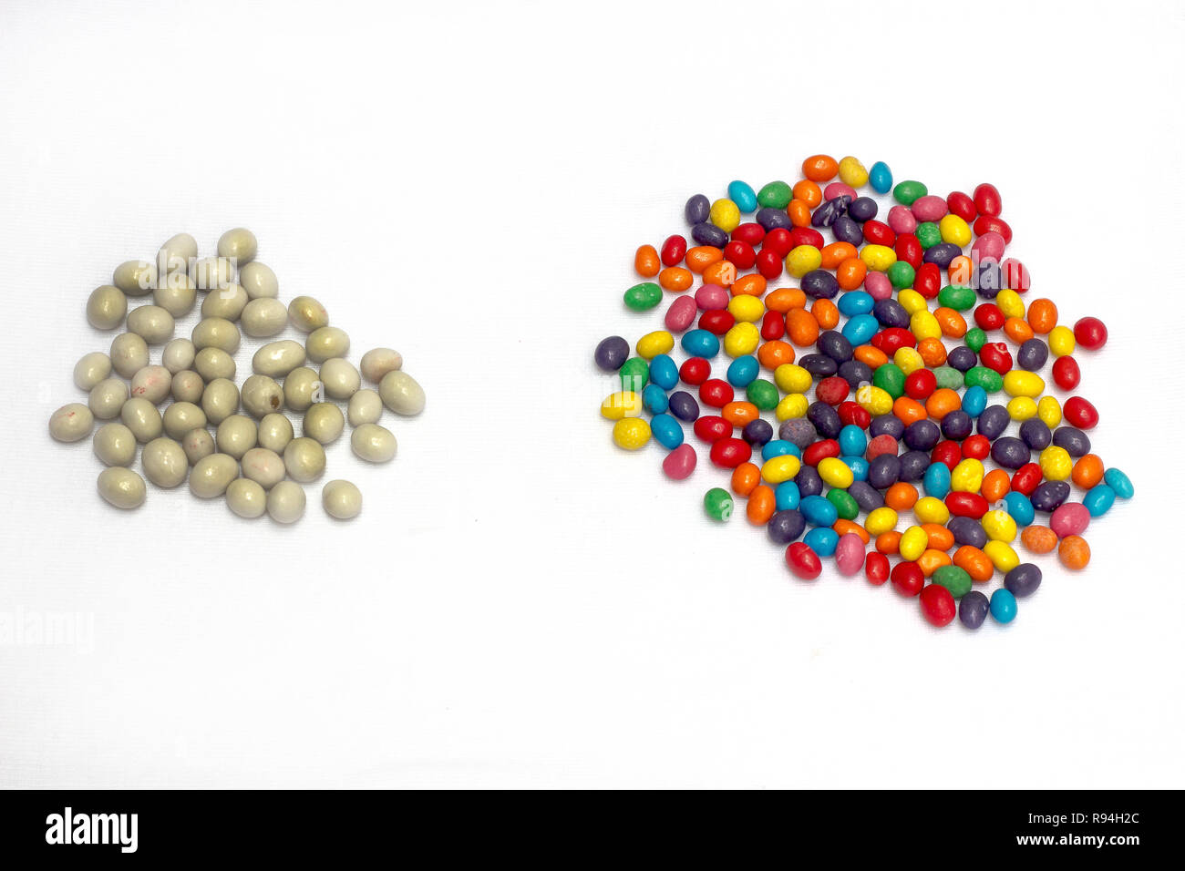 white and colorful candy scattered Stock Photo - Alamy