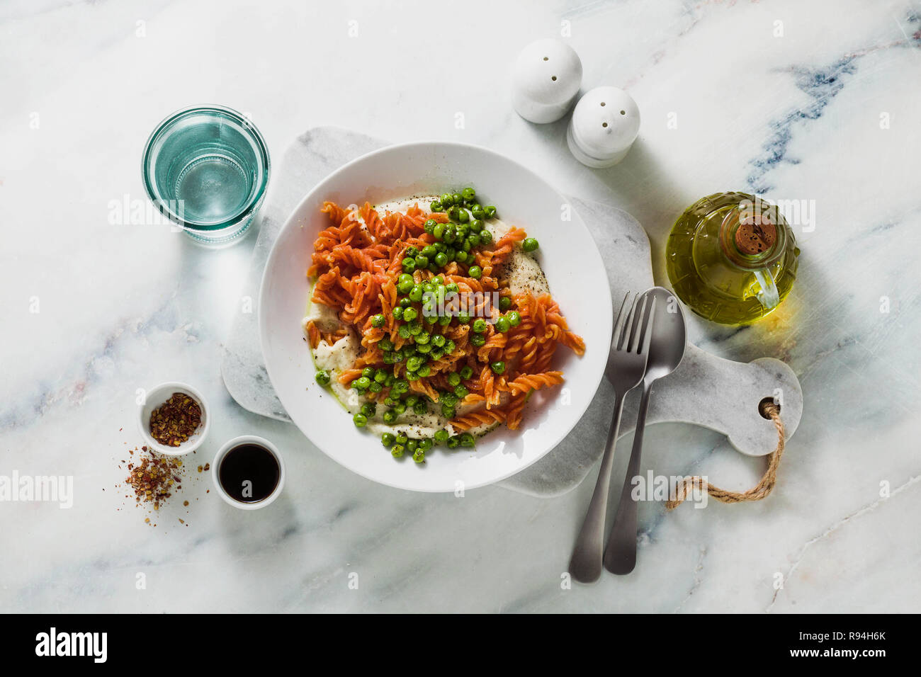 glutenfree healthy vegan red lentil pasta with green peas and