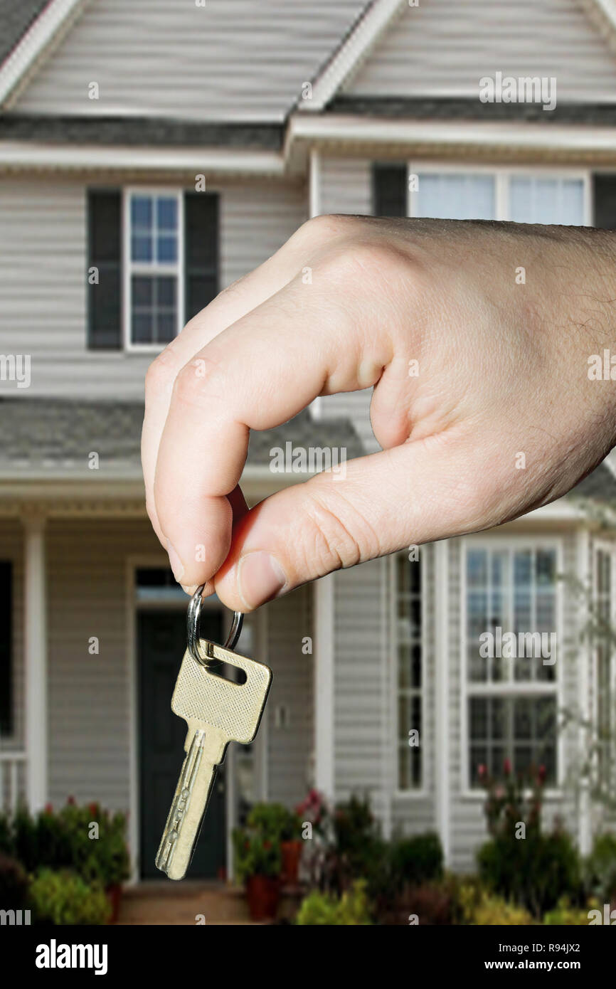 Man holds the key for new home Stock Photo - Alamy