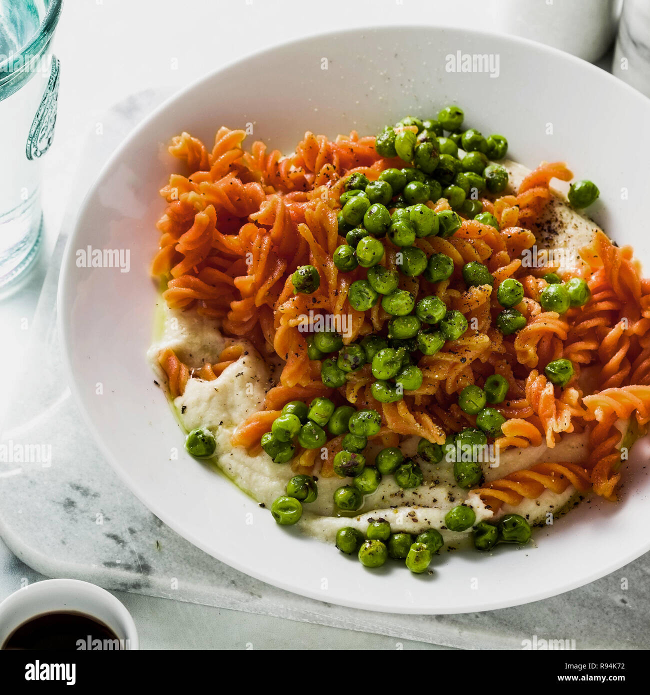 glutenfree healthy vegan red lentil pasta with green peas and