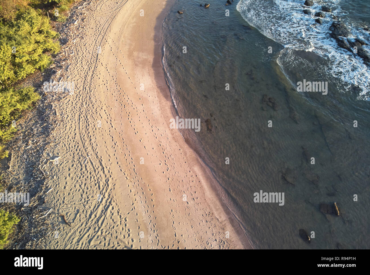 People traces on ocean beach aerial drone view Stock Photo