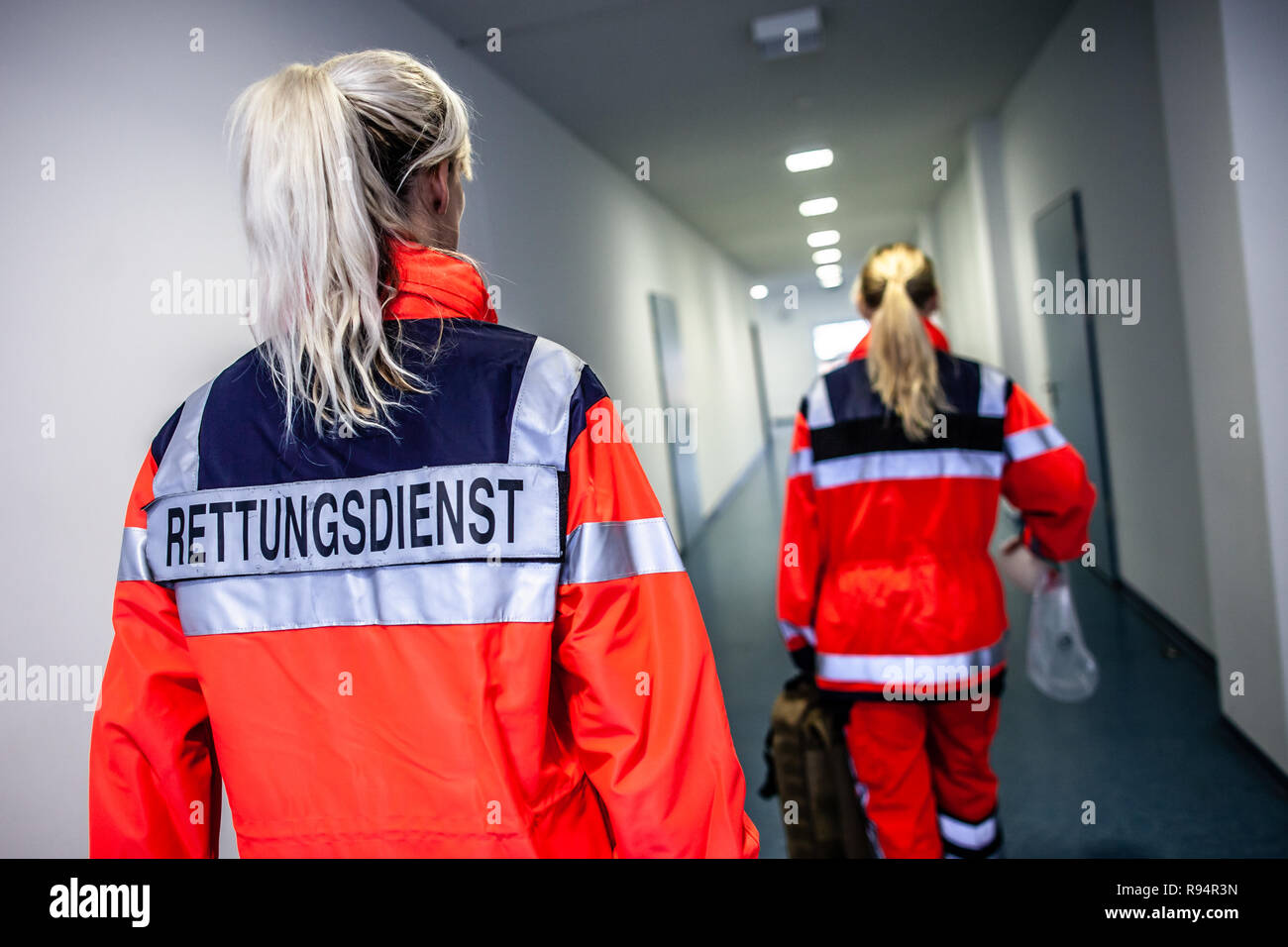 German paramedic runs in a floor to an accident. The german word  RETTUNGSDIENST means emergency service Stock Photo - Alamy