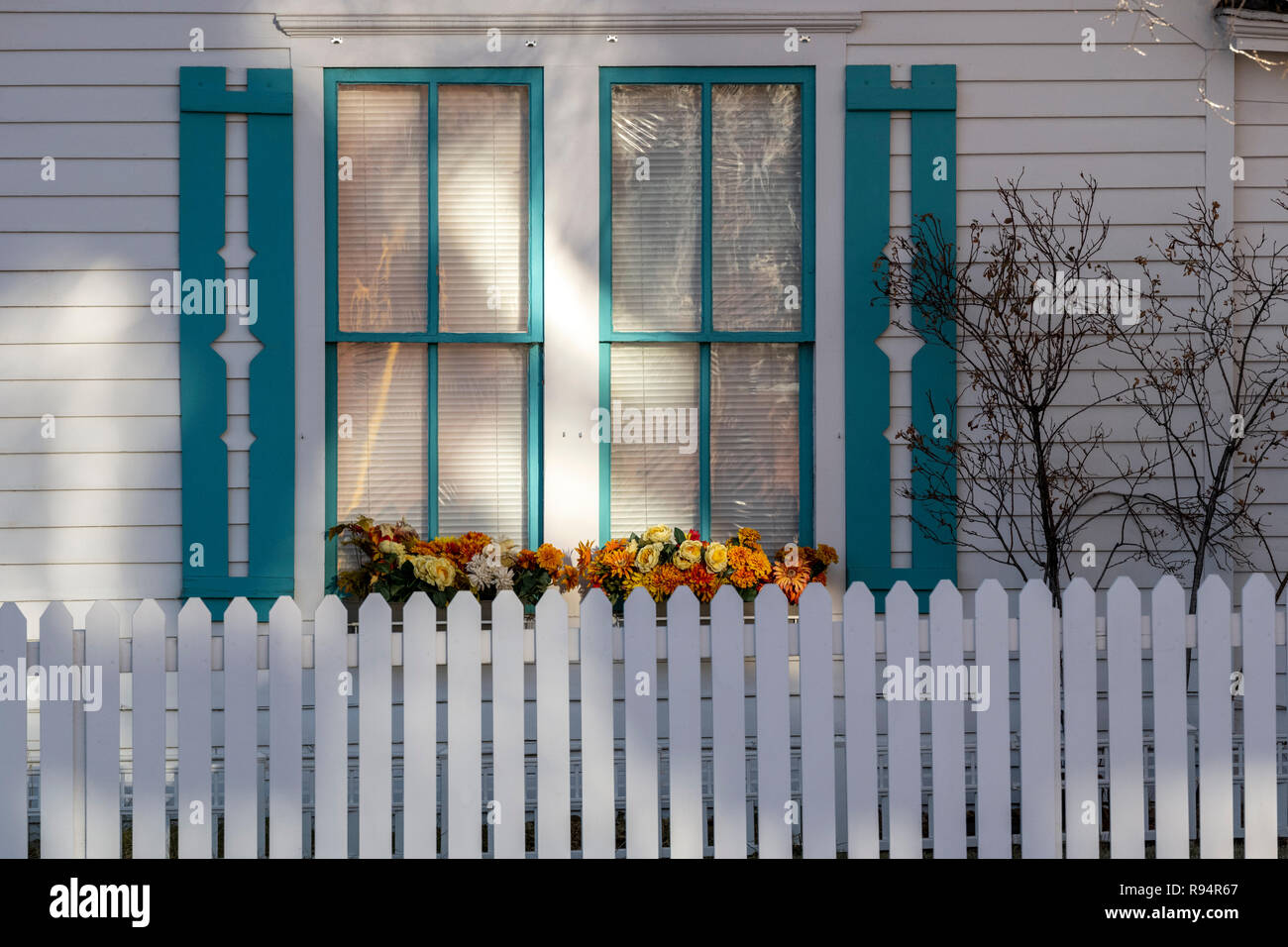 White picket fence; window & flower box; Salida; Colorado; USA Stock Photo