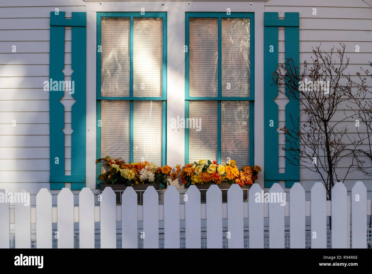 White picket fence; window & flower box; Salida; Colorado; USA Stock Photo