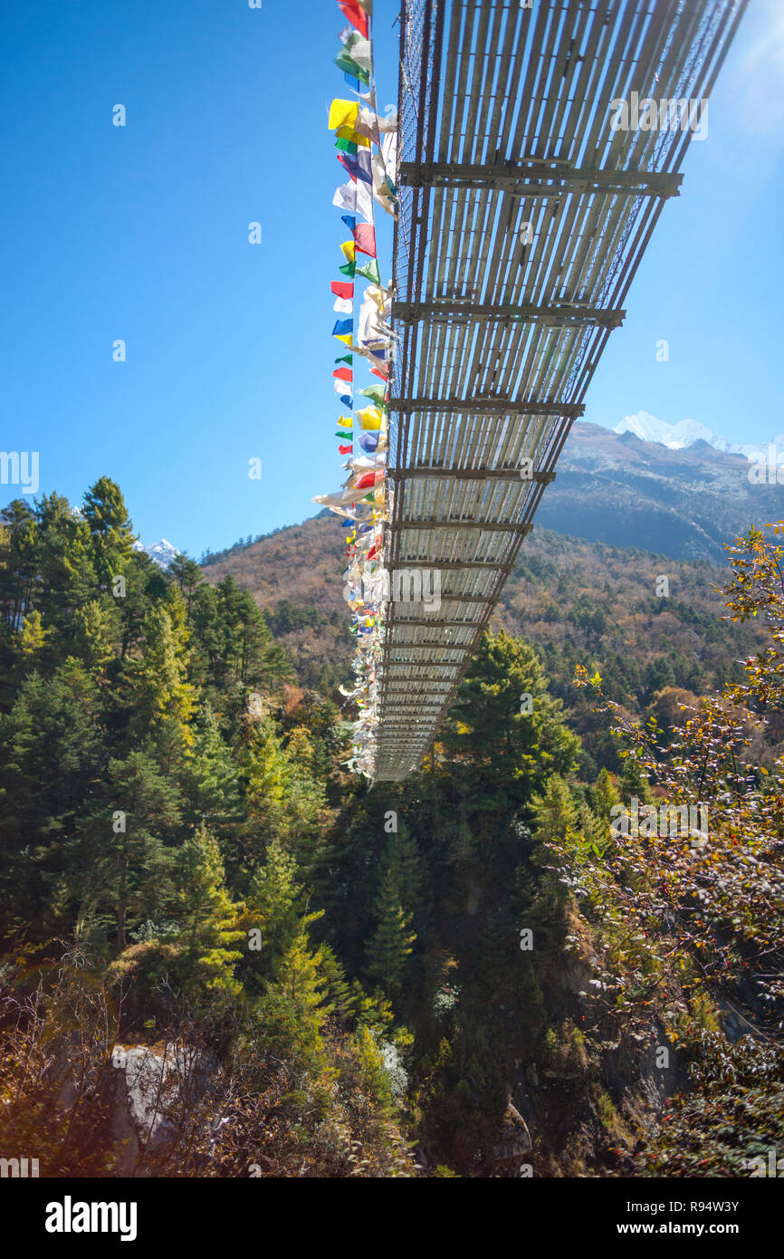 Suspension bridge over the river in Himalayas. Everest base camp trek