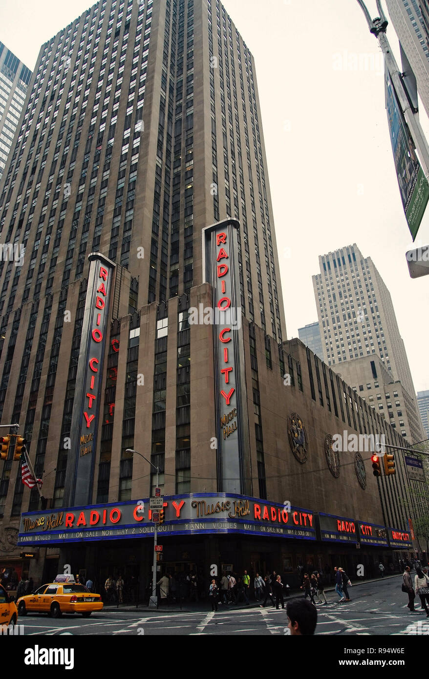 New York, USA - November 13, 2008: radio city music hall in grey skyscraper, tower, building, modern architecture on white sky background. Entertainment and tourist destination Stock Photo