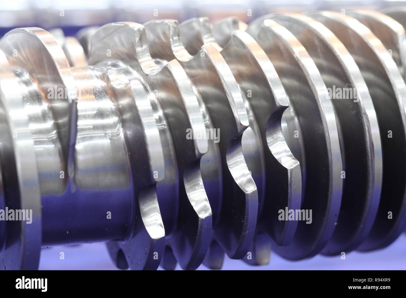 Screw press parts for plastic injection machine ; selective focus Stock Photo