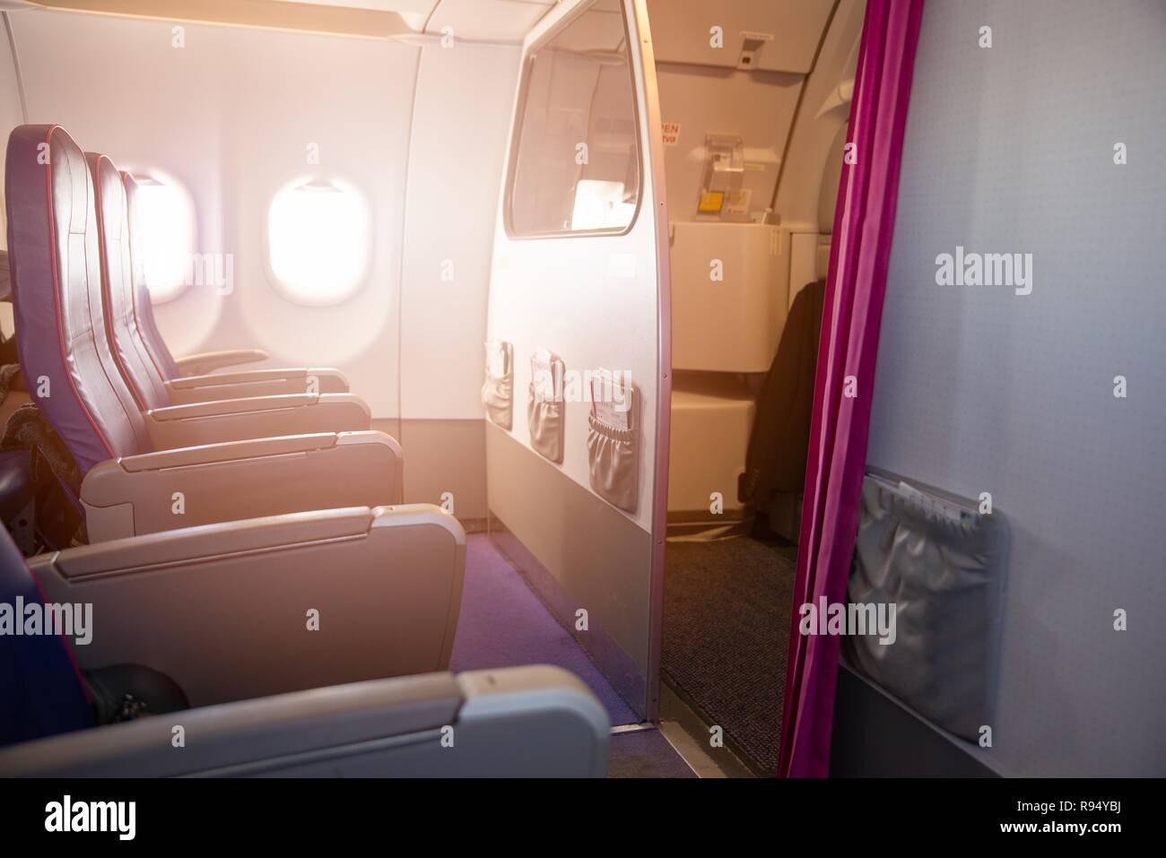 First row of seats in a passenger plane. Passenger plane interior