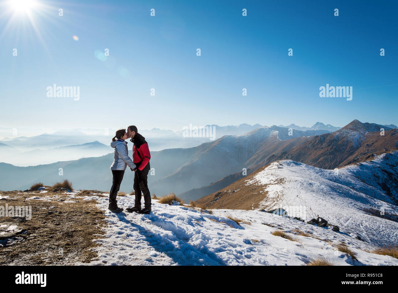 couple of lovers kissing on the mountains, italian Alps. Italy Stock Photo
