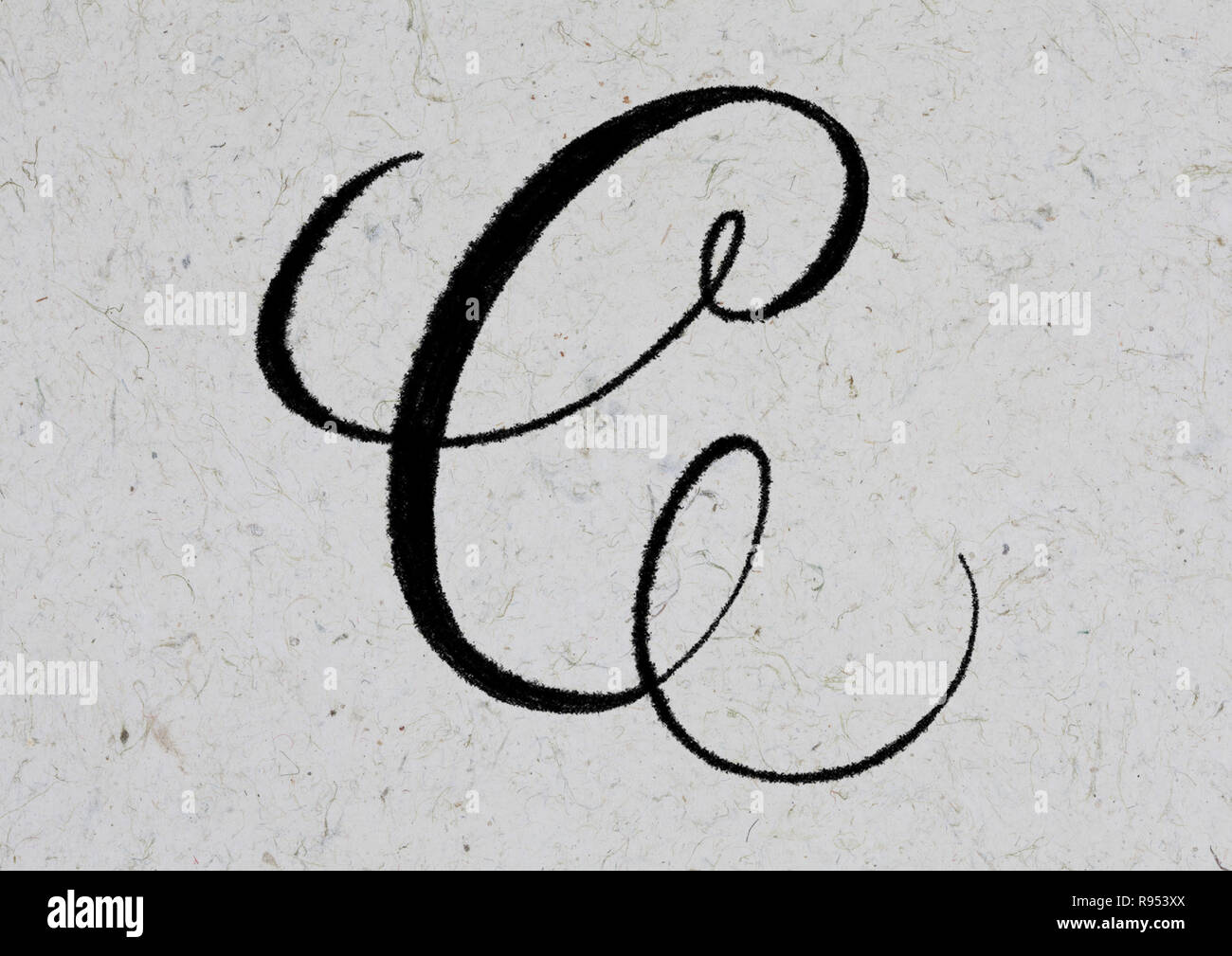 Letter C hand lettering with ink on textured kraft paper Stock Photo
