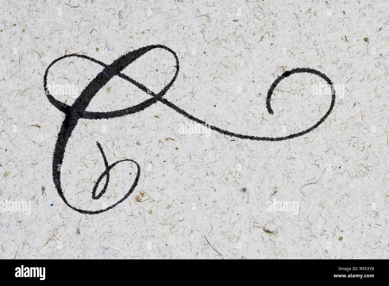 Calligraphy writing letter C in ink on kraft paper Stock Photo