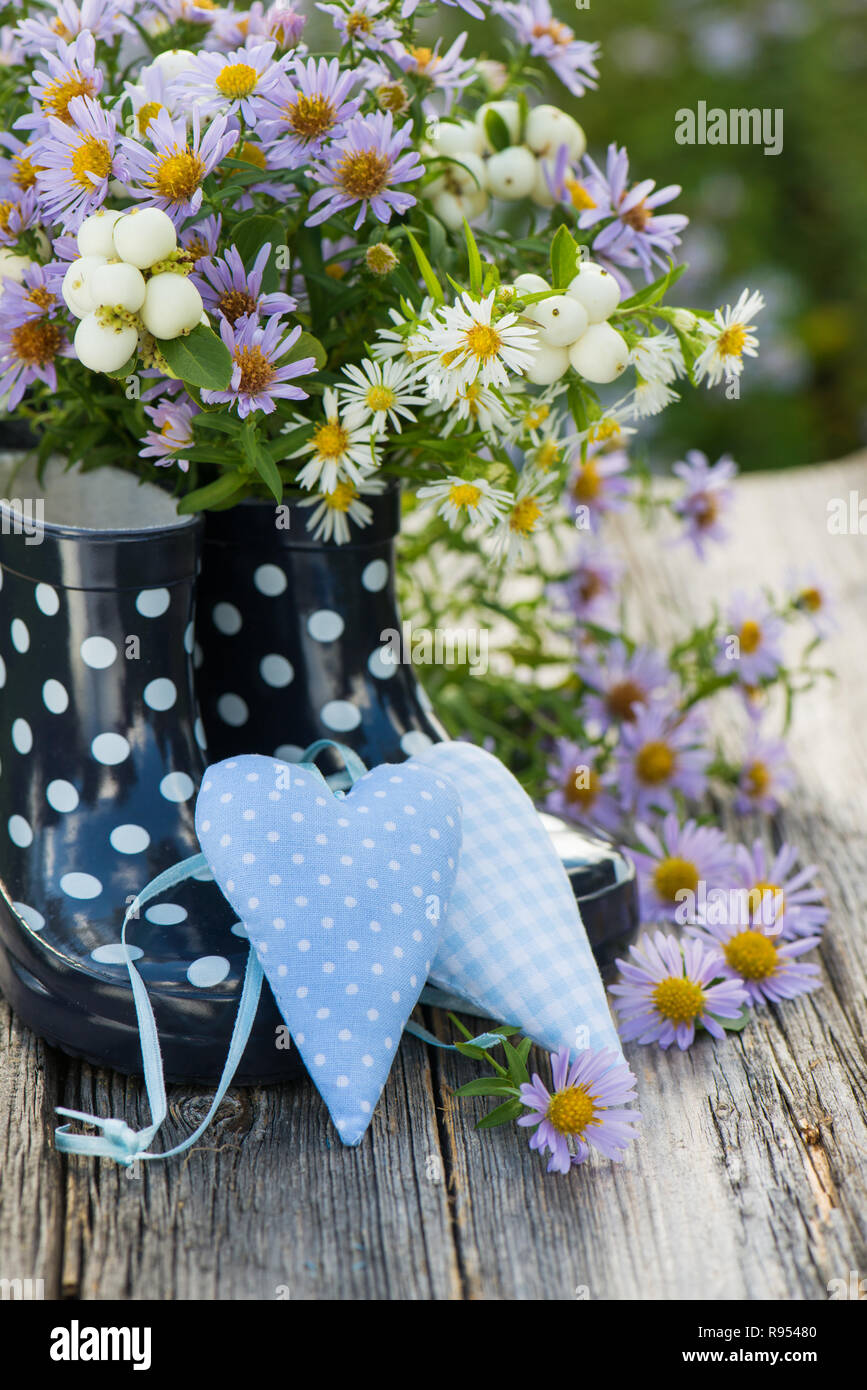 Rubber boots with flowers and hearts Stock Photo - Alamy