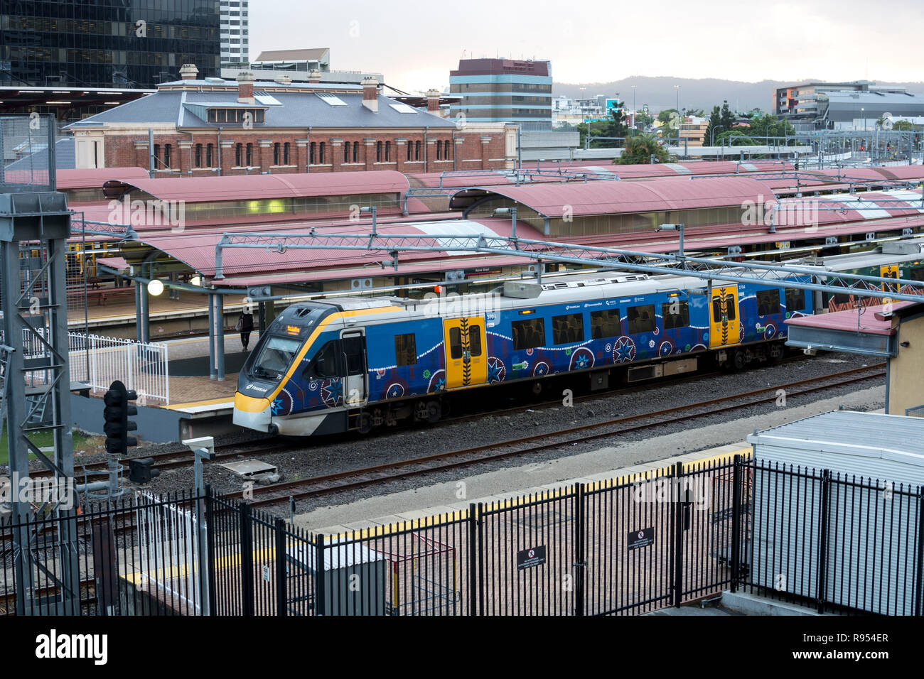 Queensland Rail train in Aboriginal art livery at Roma Street station, Brisbane, Queensland, Australia Stock Photo