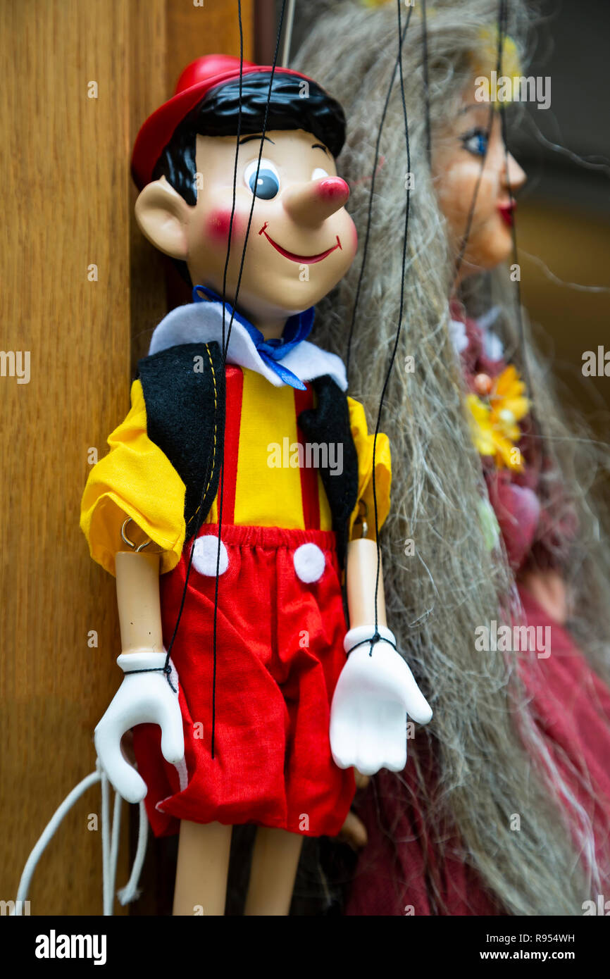 Marionettes (puppets) for sale (featuring Pinocchio), Cesky Krumlov, Czech Republic Stock Photo