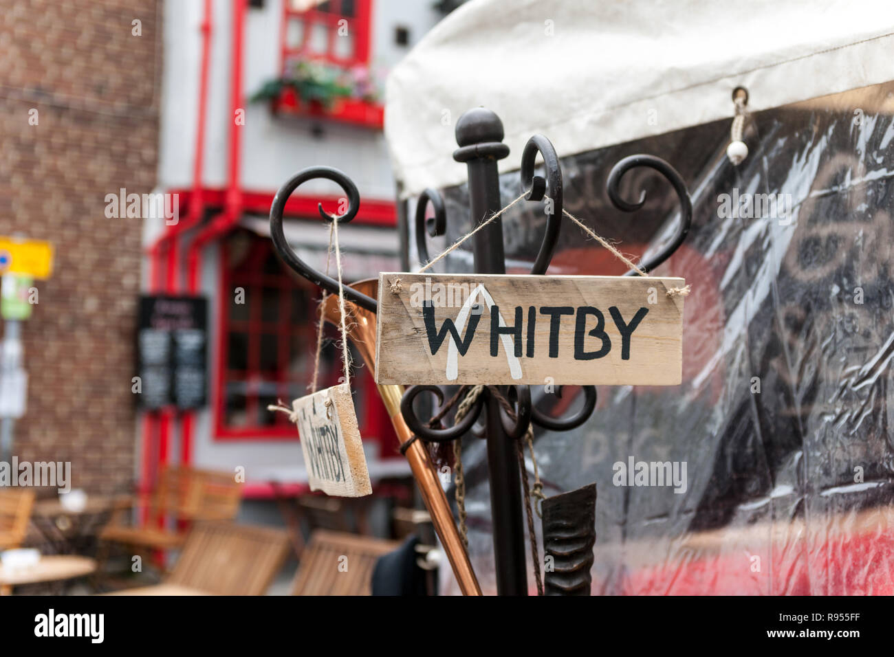 Wooden Whitby sign on coat stand Stock Photo