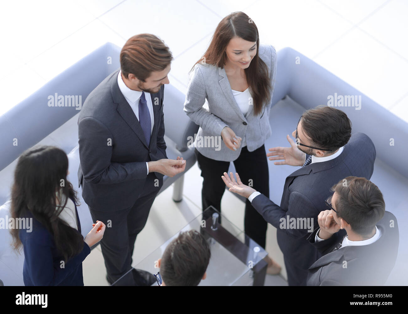 Happy smiling business team standing in a row at office Stock Photo - Alamy
