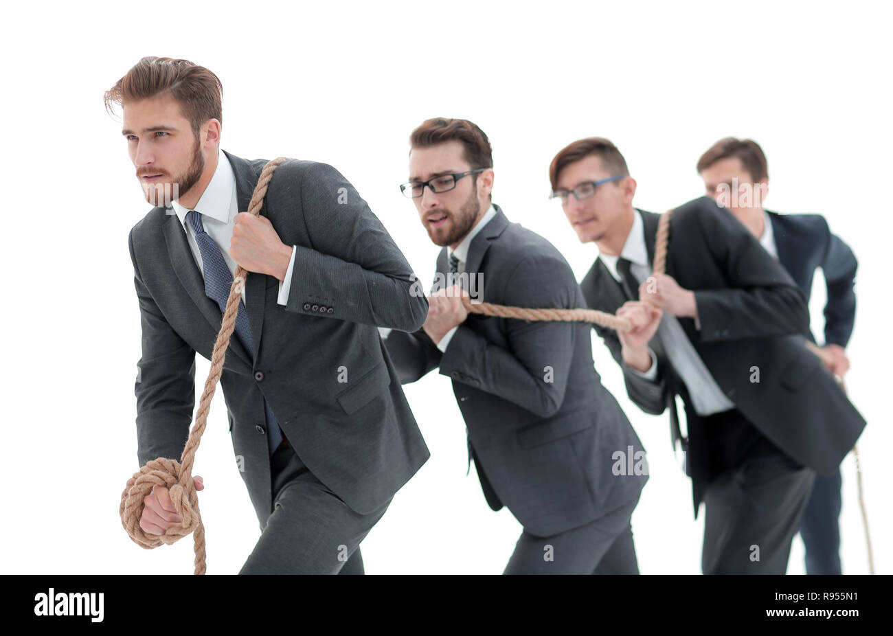 Team Members Pulling Rope closeup.smiling business team pulls the rope Stock Photo - Alamy