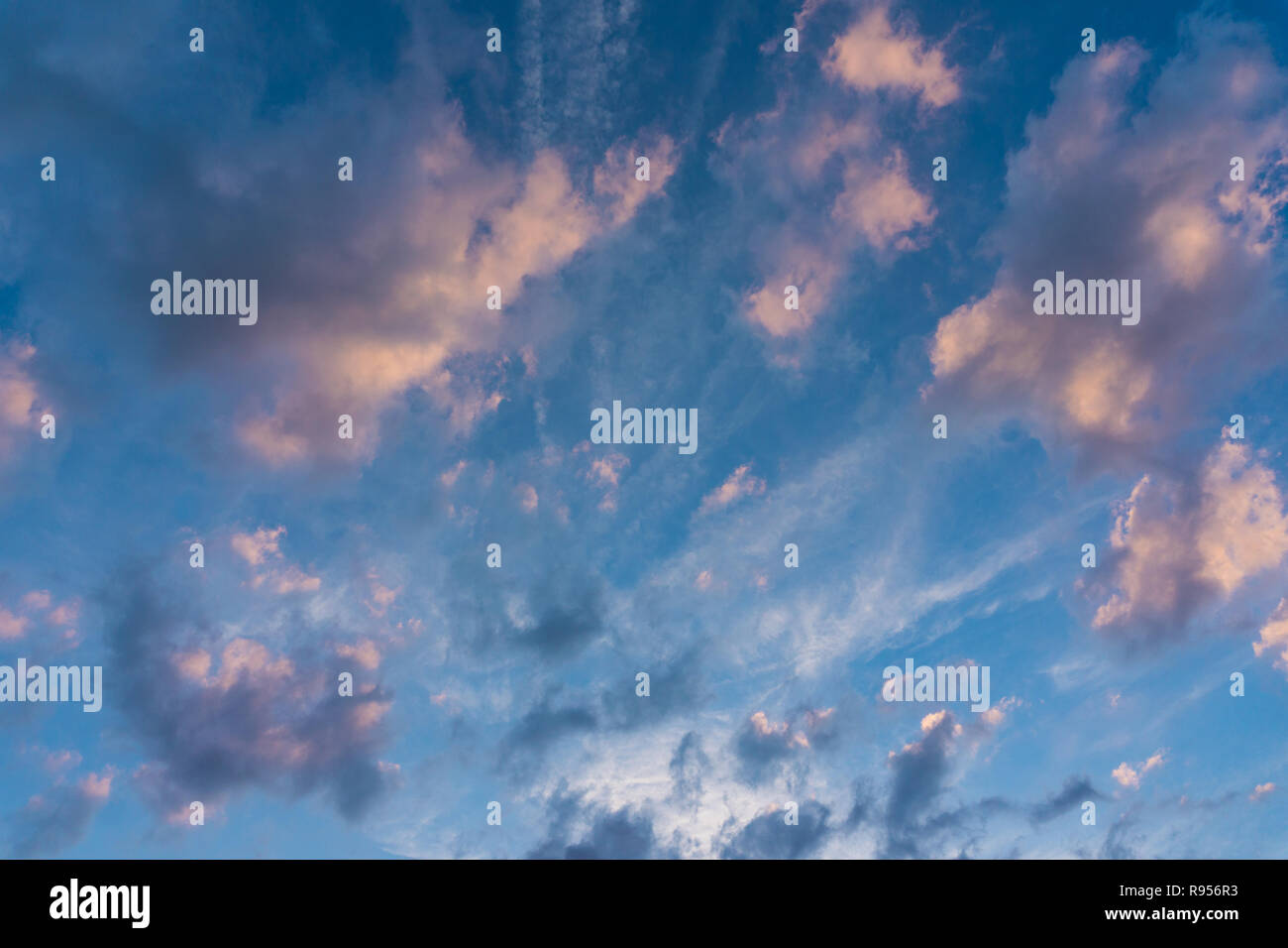 View of massive big Clouds on a colorful Sky. Stock Photo