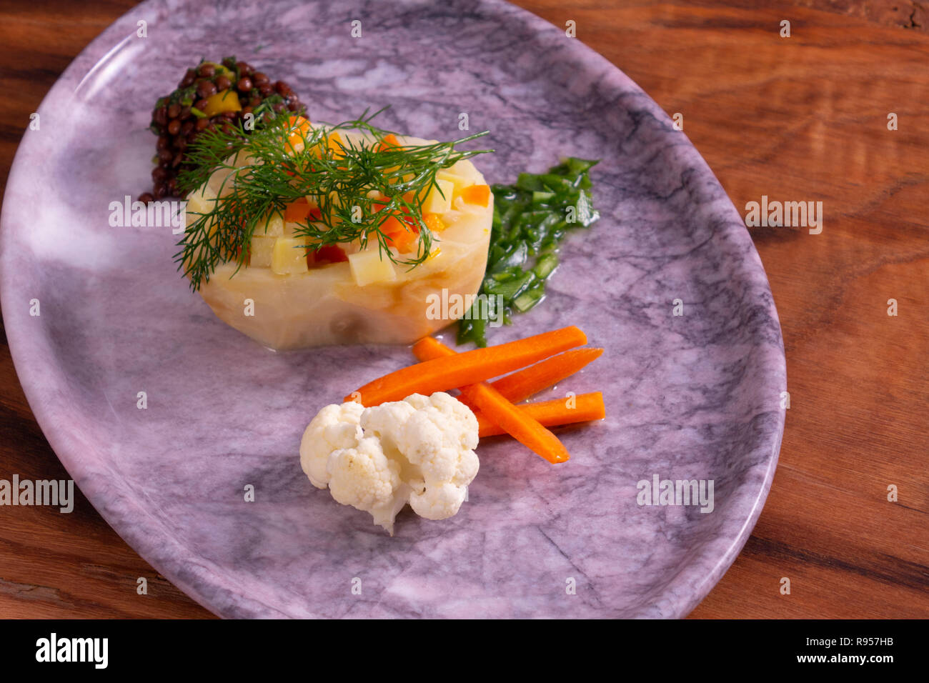 Artichokes food with Green Peas, Carrot, Potatoes and Dill in marble