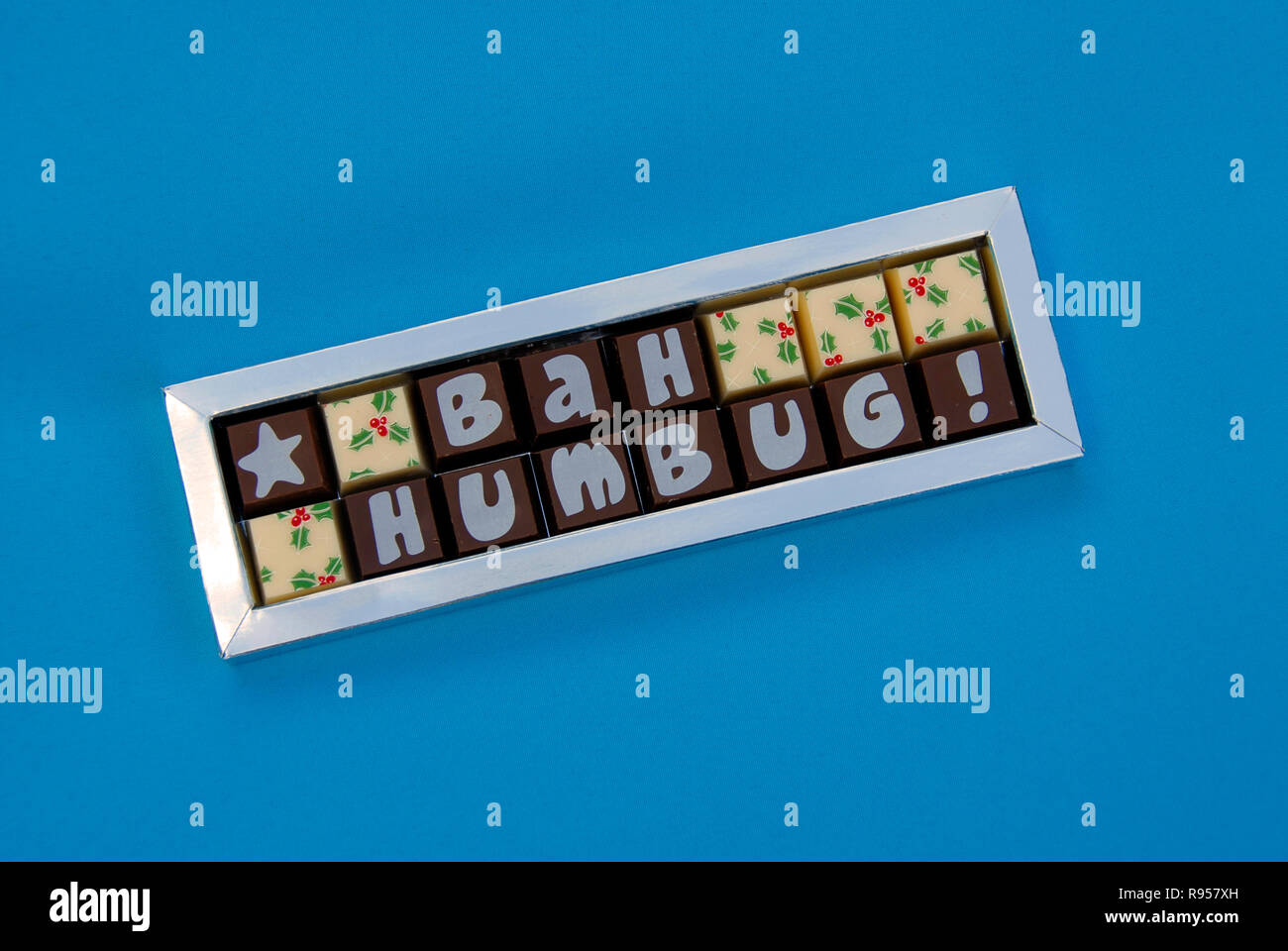 Box of Christmas sweets with the words 'Bah Humbug!' showing on the wrappers Stock Photo