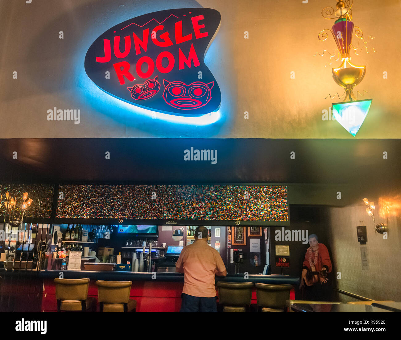 A customer waits for his order in the Hungle Room at Elvis Presley’s Heartbreak Hotel on Elvis Presley Boulevard in Memphis, Tennessee, Sept. 4, 2015. Stock Photo