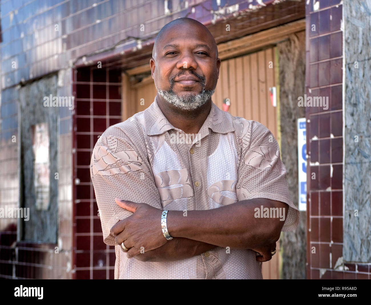 Hilton Kelley stands in front of an abandoned building in downtown Port Arthur, Texas on March 20, 2011. Stock Photo