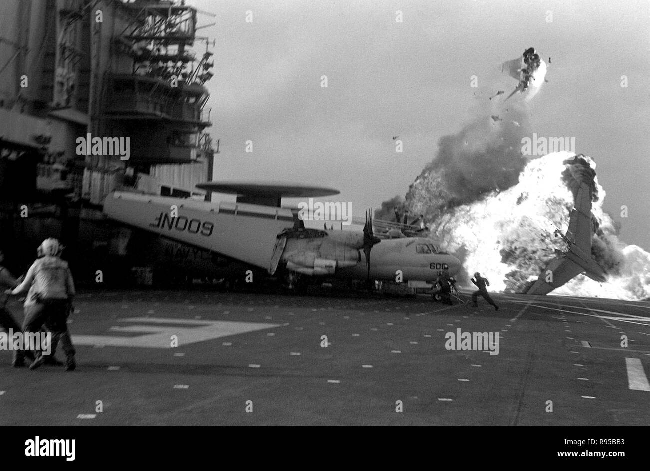 An Attack Squadron 56 (VA-56) A-7E Corsair aircraft bursts into flames after a ramp strike on the aircraft carrier USS MIDWAY (CV-41). US Navy photo. Stock Photo