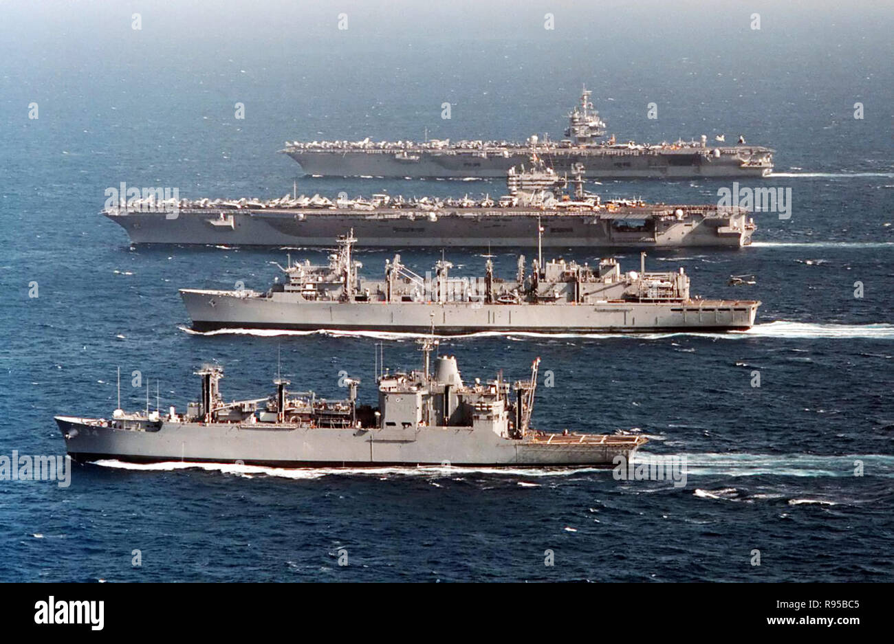 The aircraft carriers USS Enterprise (CVN 65) (top) and USS George Washington (CVN 73); the fast combat support ship USS Supply (AOE 6) and the ammunition ship USS Mount Baker (AE 34) steam in formation in the waters of the western Mediterranean Sea. DoD photo by Petty Officer 2nd Class Jim Vidrine, U.S. Navy Stock Photo