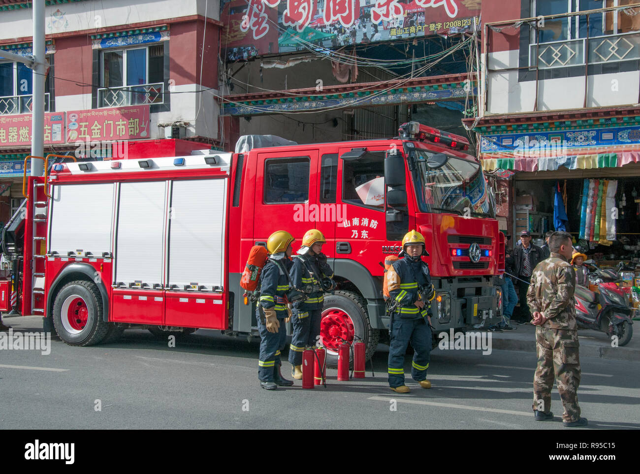 Fire truck call-out in a city street in Tsetang, Tibet, China Stock Photo