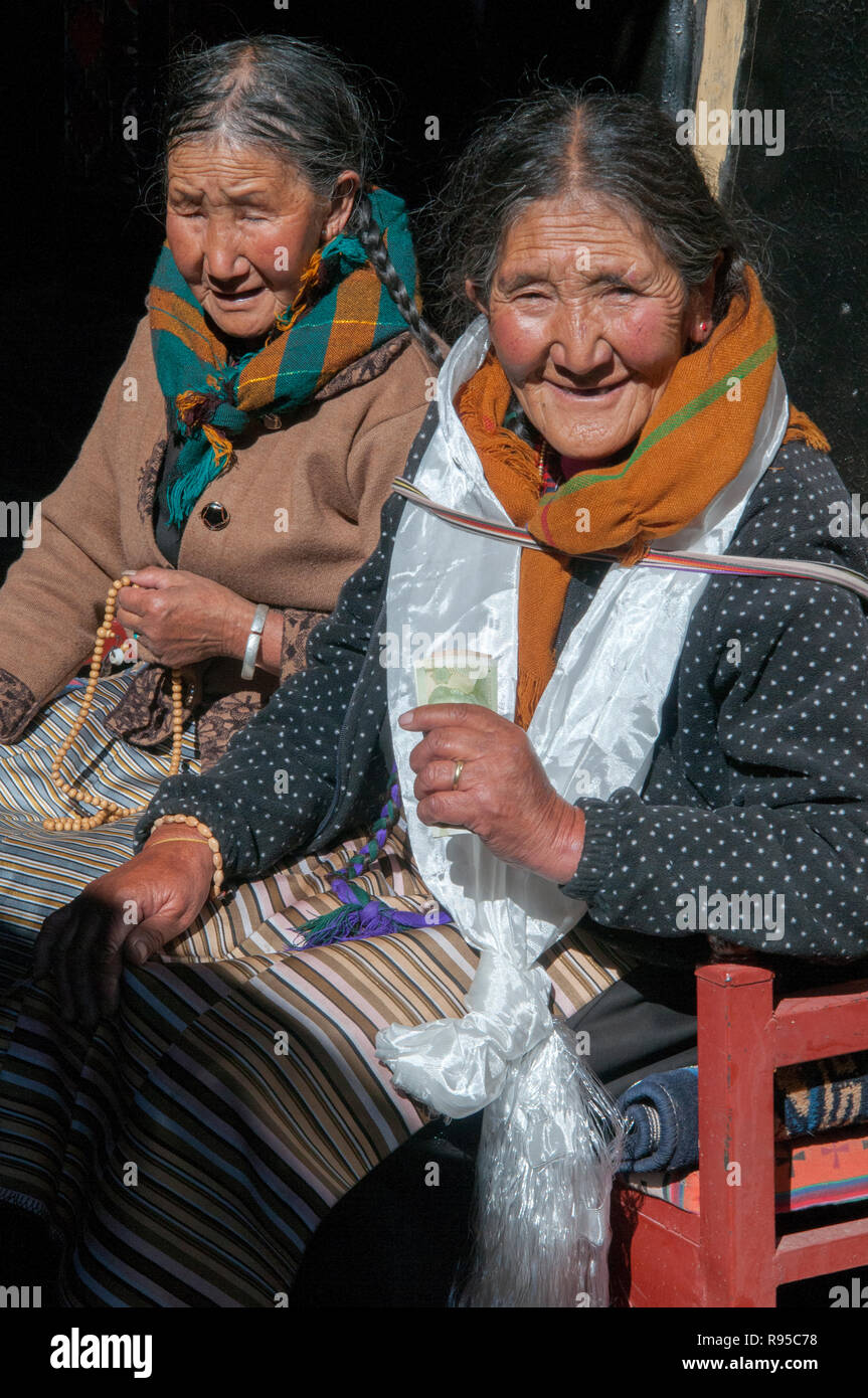 Two Tibetan women visiting Ganden Monastery, outside Lhasa, Tibet, China Stock Photo