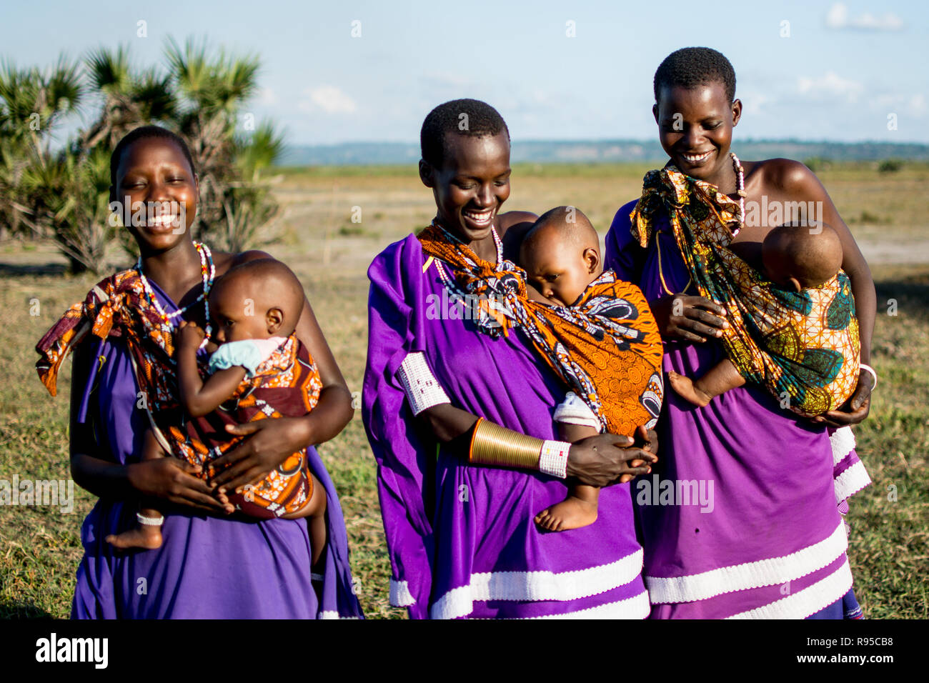 Three Maasai women breastfeeding Stock Photo