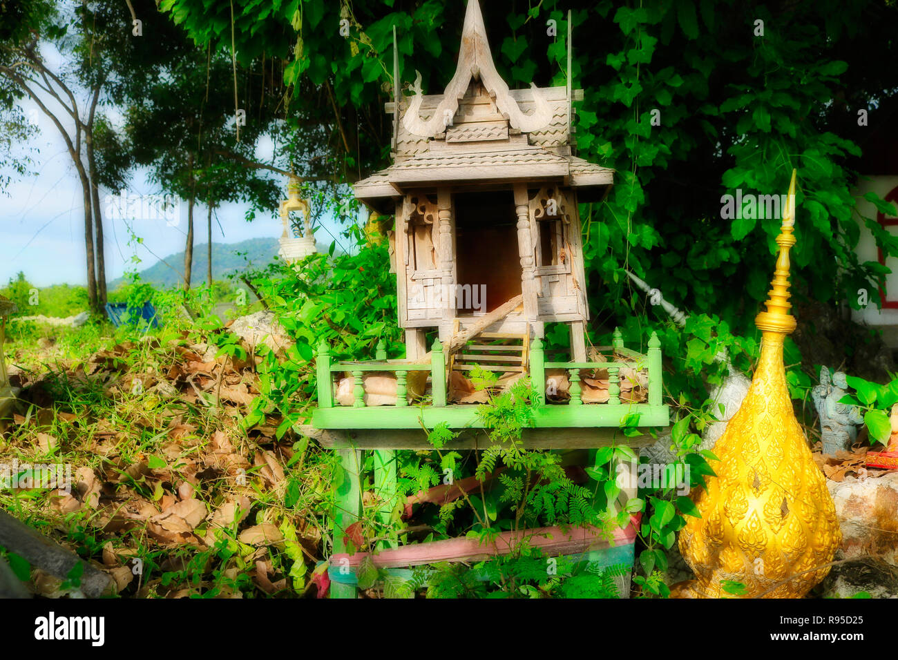 This beautiful photo shows a small dilapidated wooden temple in nature. The photo was taken in Hua Hin in Thailand Stock Photo