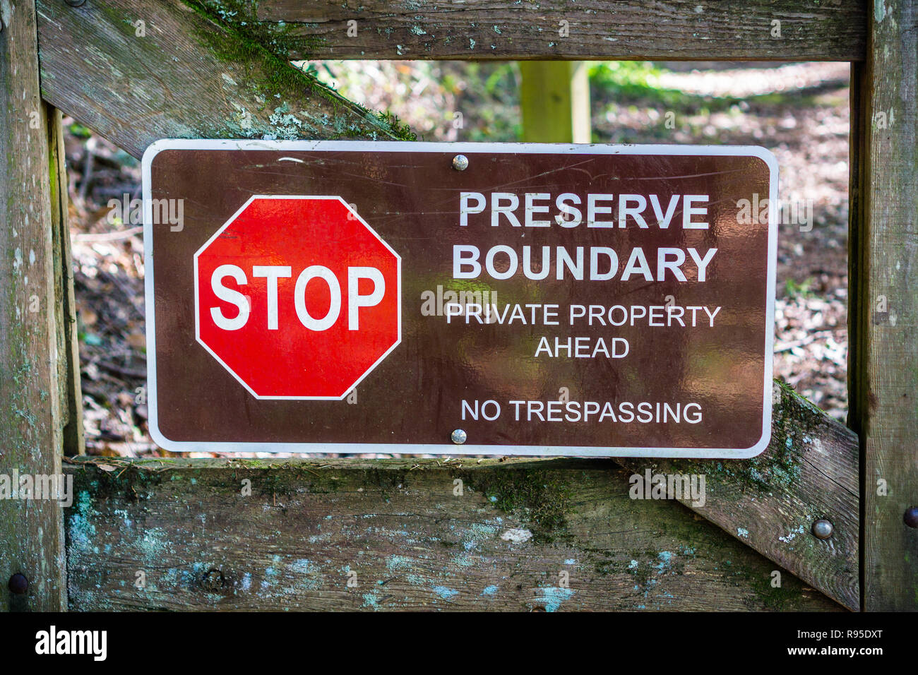 "Stop; Preserve Boundary; Private Boundary Ahead; No trespassing" sign