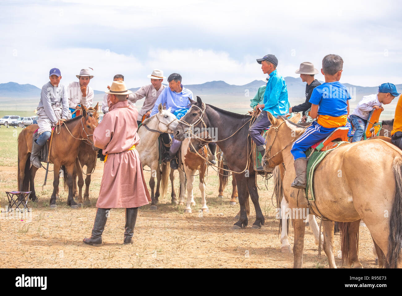 Mongolians on horses attending the rural Naadam festival, a summer event throughout Mongolia. Stock Photo