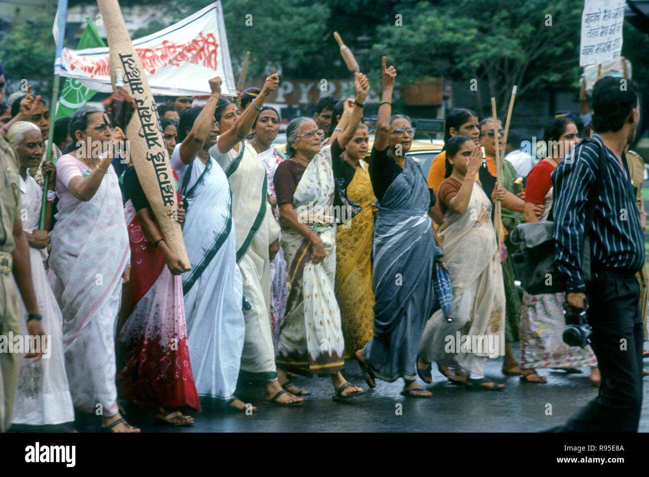 Women morcha protest agitation demonstration holding belan rolling pin against inflation in Bombay, Mumbai, Maharashtra, India, Asia Stock Photo