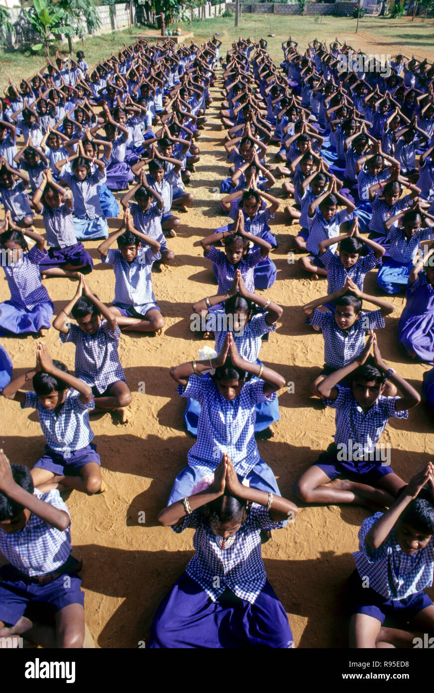 students doing yoga for physical eagerness Stock Photo