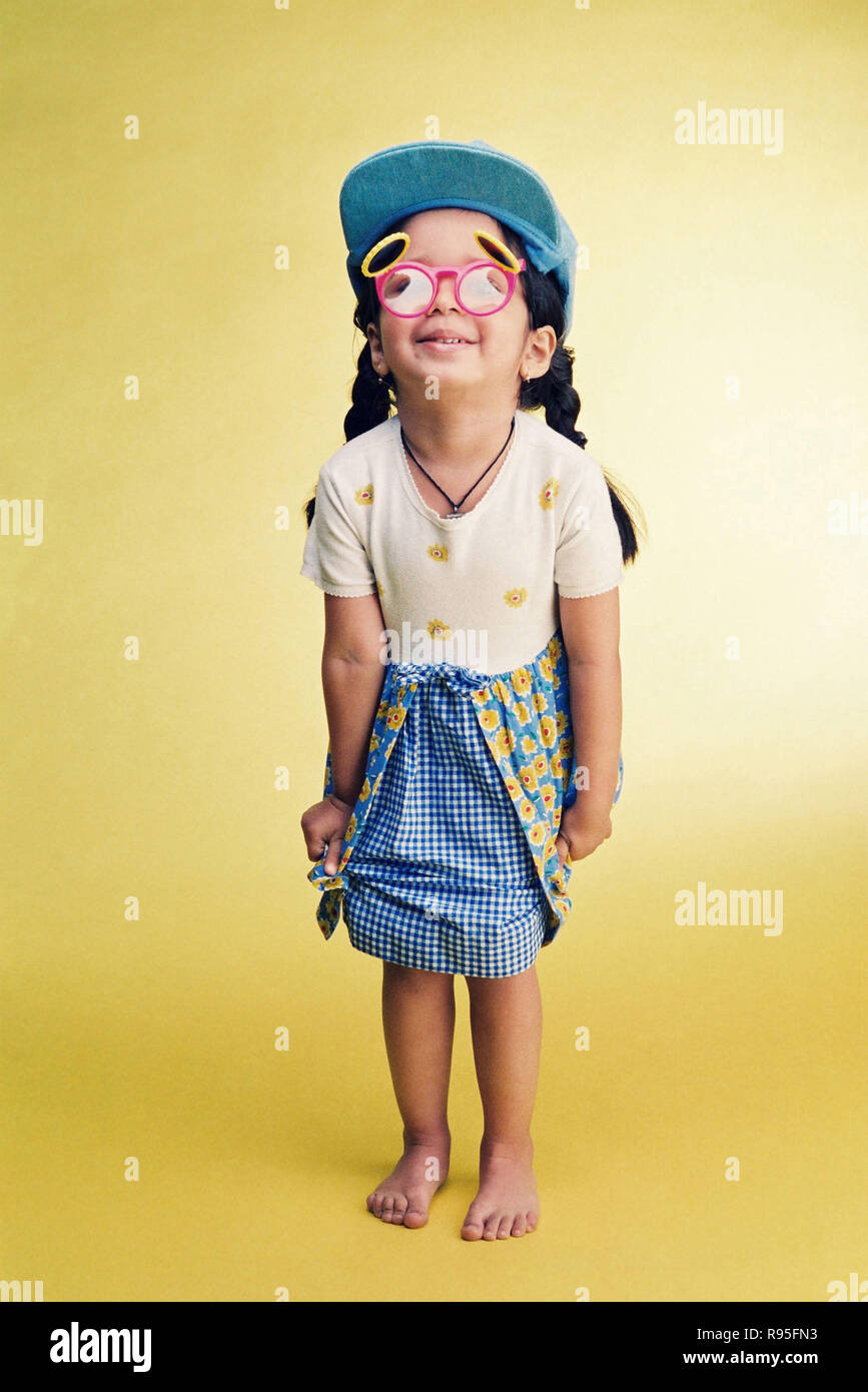 Girl child wearing funny glasses and cap Stock Photo Alamy